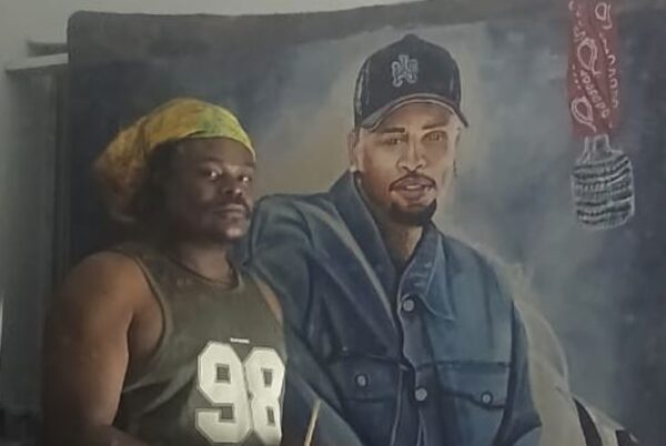"Rasta Displays His Painting of Chris Brown (Photos)"